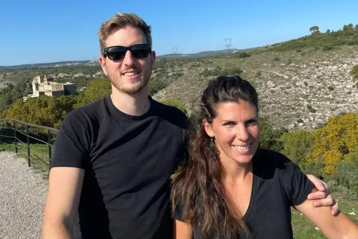 Alex and his wife outdoors