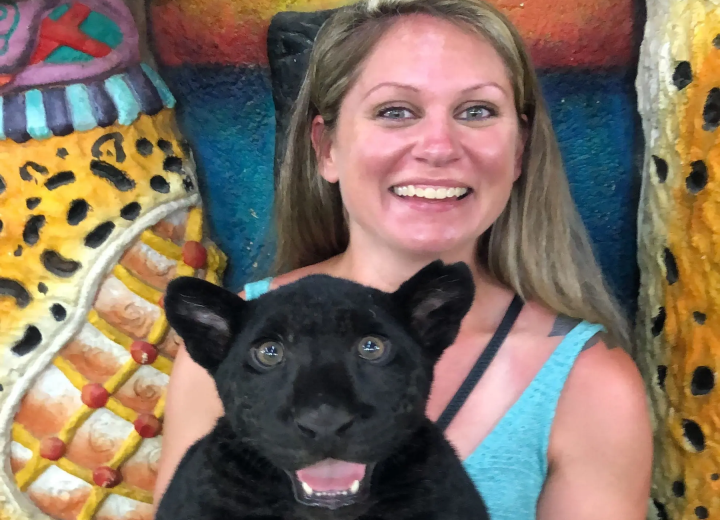 Amy holding a black panther cub