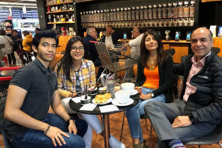 Eduardo and his family at a cafe