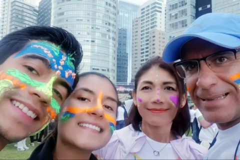 A selfie of Eduardo and 3 other people wearing face paint